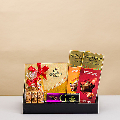 Presenting an elegant gift for those with impeccable taste: a stylish gift tray with luxurious Godiva chocolates.