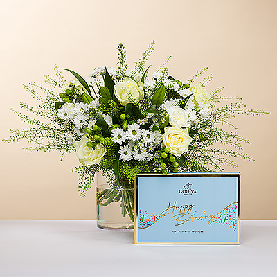 As bright as a twinkling diamond, we present you this stylish bouquet, all in white. The beautiful flowers are accompanied with a festive Happy Birthday gift box filled with dreamy Godiva chocolate truffles.