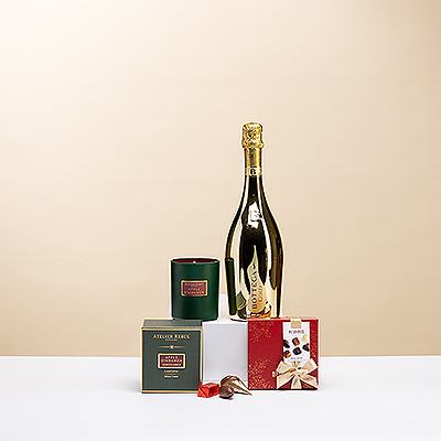 Celebra la Navidad con este exclusivo trío de regalo que incluye Bottega Gold Prosecco Spumante, seis bombones navideños Neuhaus y una lujosa vela perfumada Atelier Rebul Manzana y Canela de edición especial.