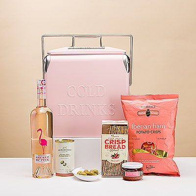 Presenting the ultimate pink picnic gift on the go! In this exclusive gift, we handpack a beautiful bottle of Secret of Pink Rosé wine with delicious tapenade, olives with anchovies, chili crisp breads, and potato crisps into a fun, retro pink drinks cooler. It's the perfect summer picnic gift for weddings, birthdays, and hostess gifts.