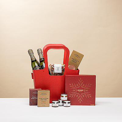 Delight your loved ones with a sparkling Cava Christmas brunch handpacked in a reusable red Koziol Taschelino tote. Inside the go-anywhere tote is everything needed for a memorable Christmas morning.