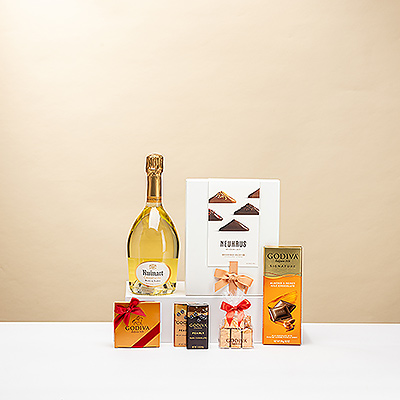 Treat your friends, family, and colleagues to this VIP Champagne and chocolates gift for special occasions. A prestigious bottle of Ruinart Champagne is presented with iconic Neuhaus Irrésistibles and premium Godiva chocolates.