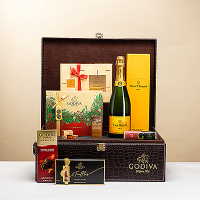 Perfect for life's most important occasions: a stunning Godiva logo croco gift hamper with a scrumptious collection of luxurious Godiva chocolates and iconic Veuve Clicquot Champagne. This impressive Champagne and chocolate gift is the sweetest way to celebrate Christmas, New Year's, and grand business successes.