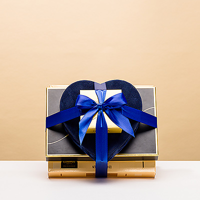 Presenting the perfect Valentine's Day gift for him: a tower of enticing Godiva chocolates with a luxurious blue velvet heart gift box. Your husband or boyfriend will melt for this mouthwatering collection of Godiva's finest assorted chocolates, dreamy truffles, and Carrés.