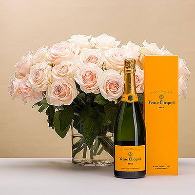 Delight that special someone with a lovely bouquet comprised of 20 light pastel colored roses presented with a luxurious bottle of Veuve Clicquot Champagne. The perfect pairing of romantic roses with fabulous bubbly is the perfect gift for weddings, anniversaries, her birthday, or any romantic occasion.